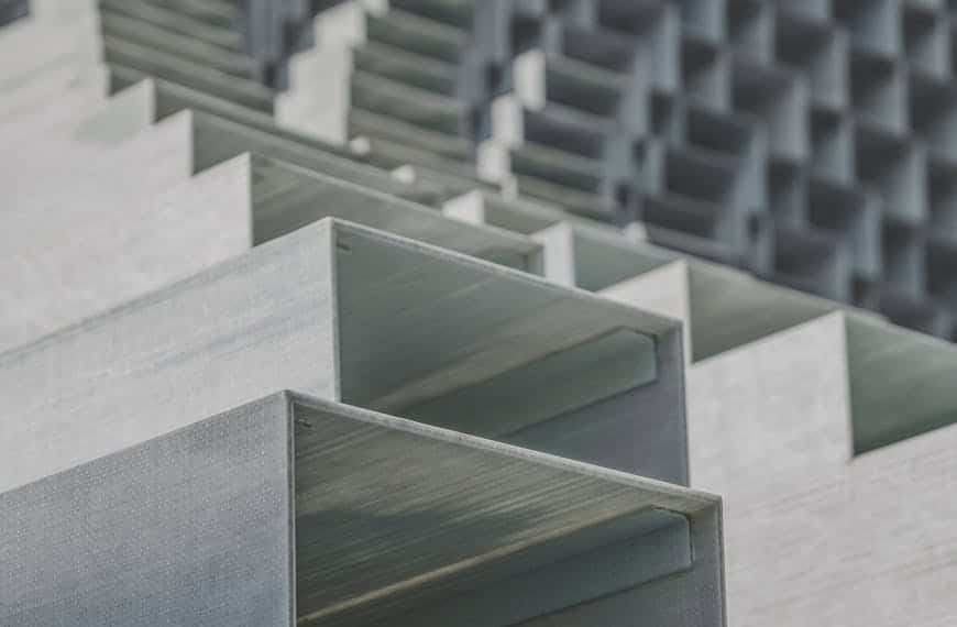 Close-up of abstract geometric metal structures with a minimalist and urban vibe.