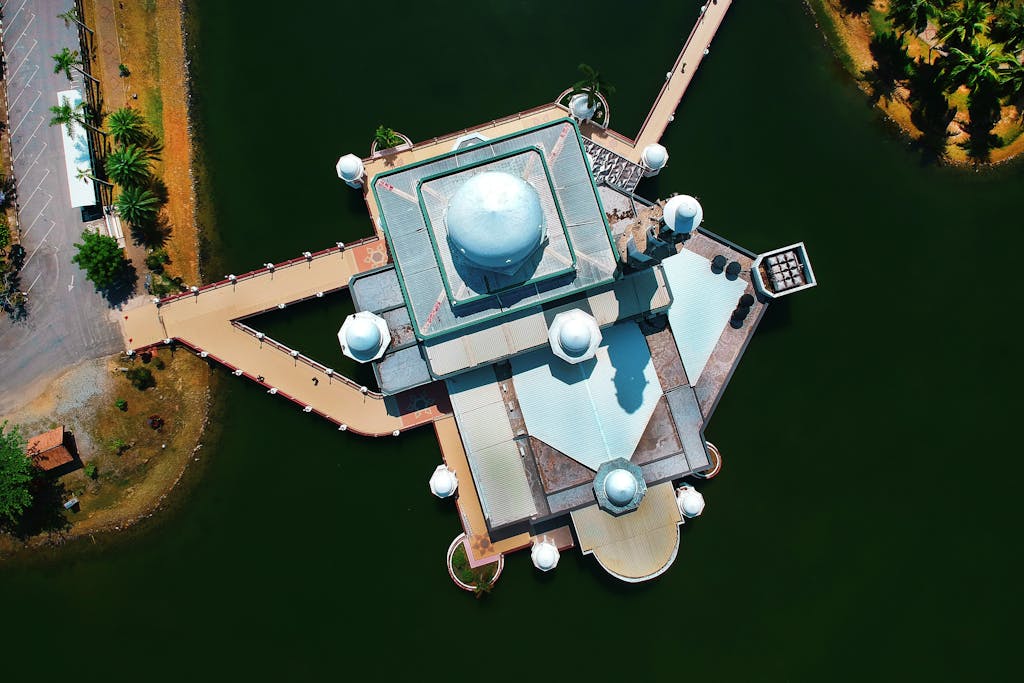 Stunning aerial shot of a modern riverside building with unique geometric design.