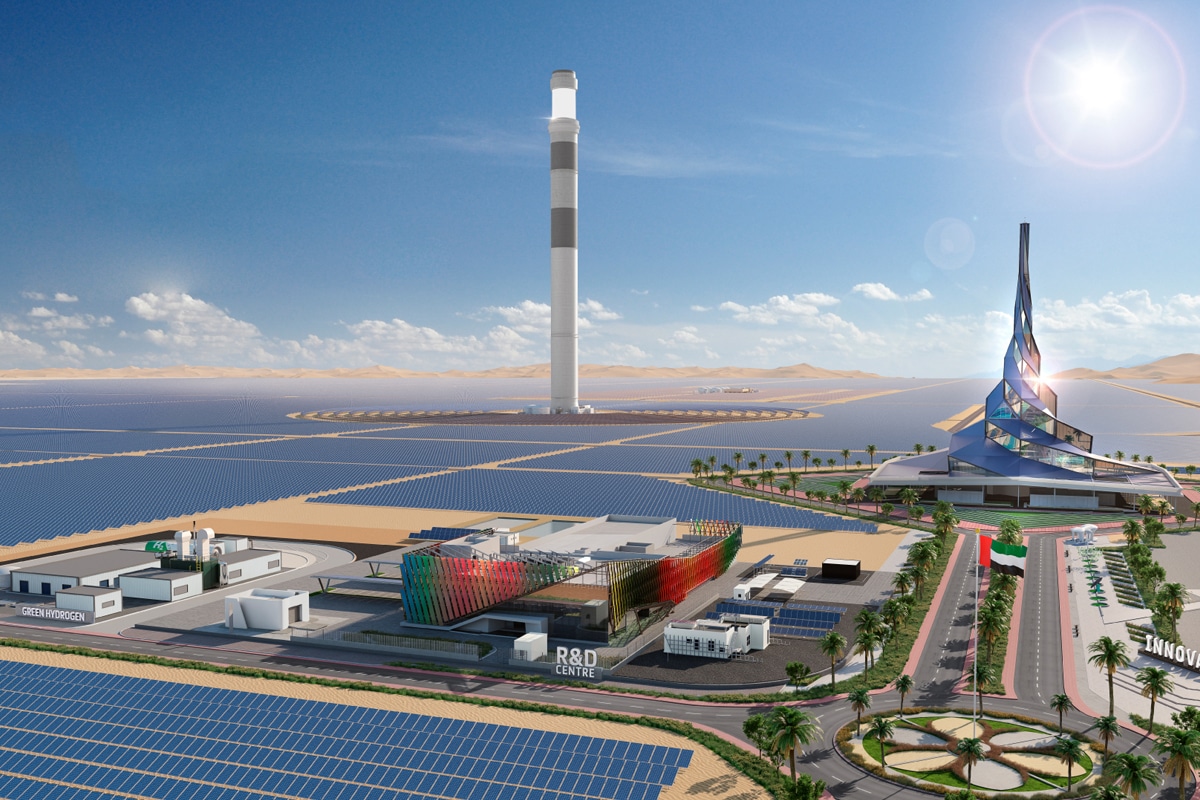 The Mohammed bin Rashid Al Maktoum Solar Park with solar panels, the main building, and the UAE flag in the background.