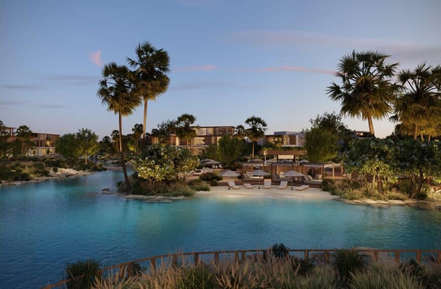 A luxurious resort surrounded by greenery and artificial lakes.