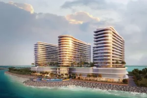 Three large buildings with unique designs on the waterfront in Ras Al Khaimah