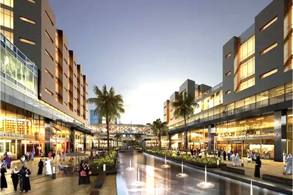 Commercial area in South Saad Al Abdullah Project with waterway and modern buildings