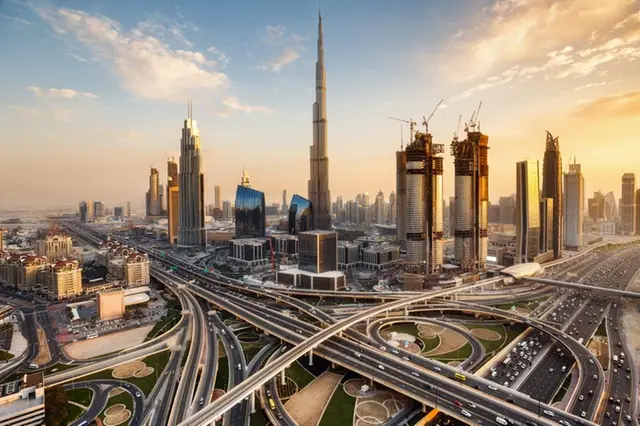 Aerial view of Dubai’s modern infrastructure and roads with Burj Khalifa in the background