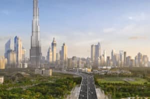 A view of Dubai featuring Burj Khalifa with a highway surrounded by greenery