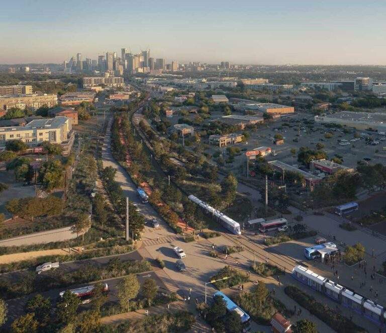 Aerial view of a modern transit project connecting city areas.