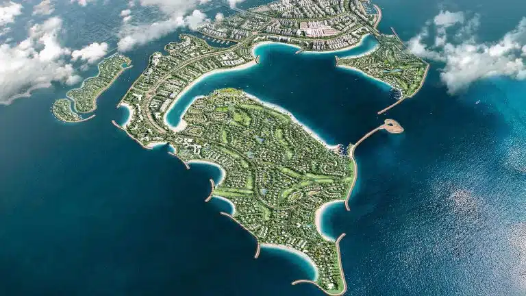 Aerial view of Dubai Islands showcasing waterfront development and green spaces.