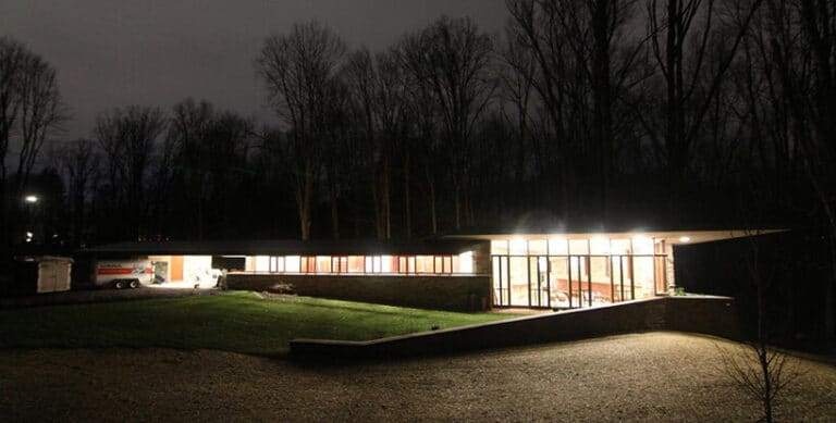"Exterior of Frank Lloyd Wright's RiverRock illuminated at night"