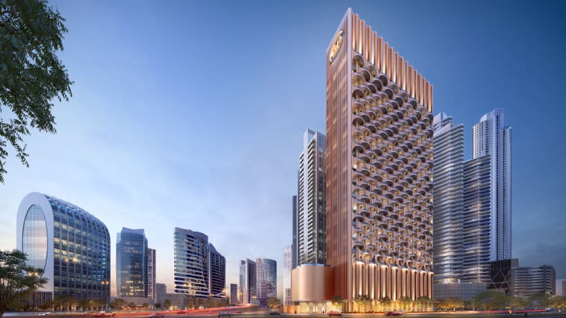 "One Residence Tower Dubai during the day, blending with surrounding buildings."