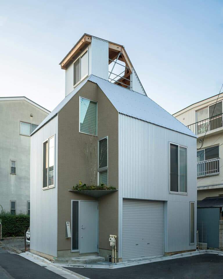 "Exterior view of a compact urban home showcasing vertical design principles, embodying the concept of compact urban design."