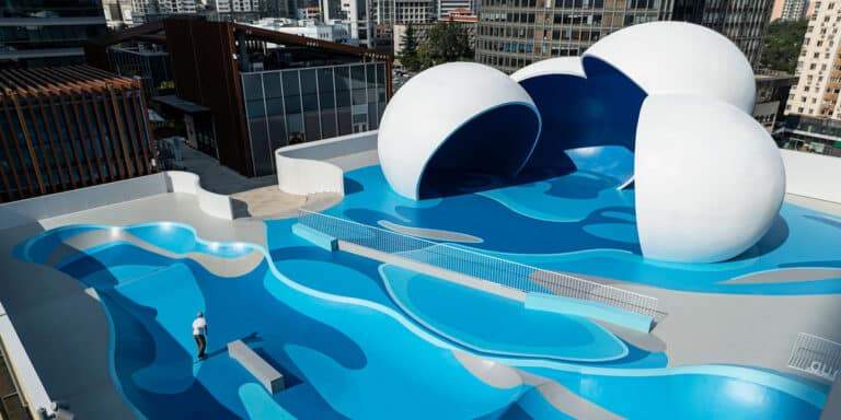"A shopping center in Qingdao with an innovative rooftop skatepark inspired by ocean waves