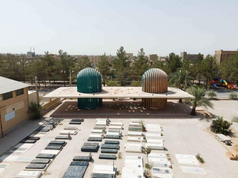 : "Aerial view of the Shafagh Tomb in Ardakan, Iran, featuring dual domes and open passageways that connect life and death."