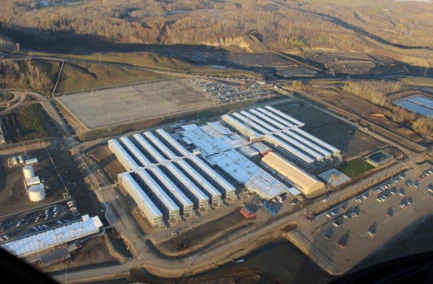 A large industrial facility in a natural area.