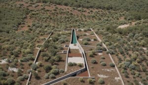 Modern interior with minimalistic furniture and a view of the landscape through a large glass wall