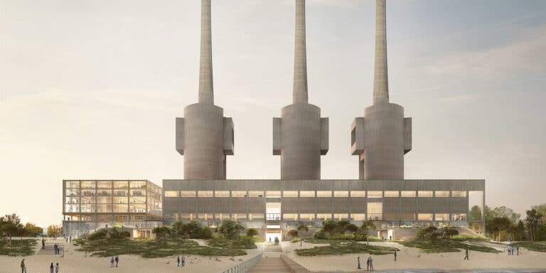Industrial building with three tall chimneys