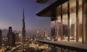 Night view of Dubai skyline with a glimpse of the Baccarat Hotel and Residences project