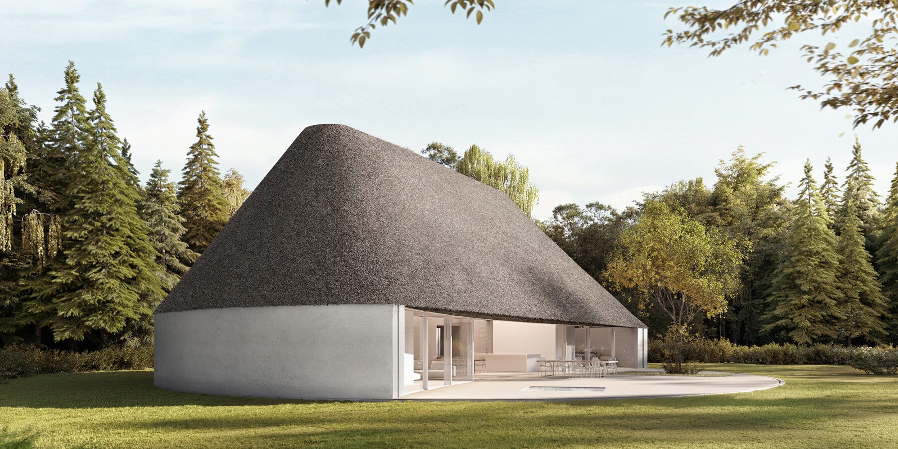 Modern house with thatched roof in a natural setting