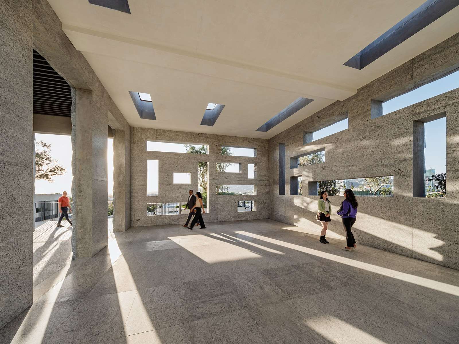 Breezeways and air passageways connecting the concrete volumes in the Vertical Mausoleum.