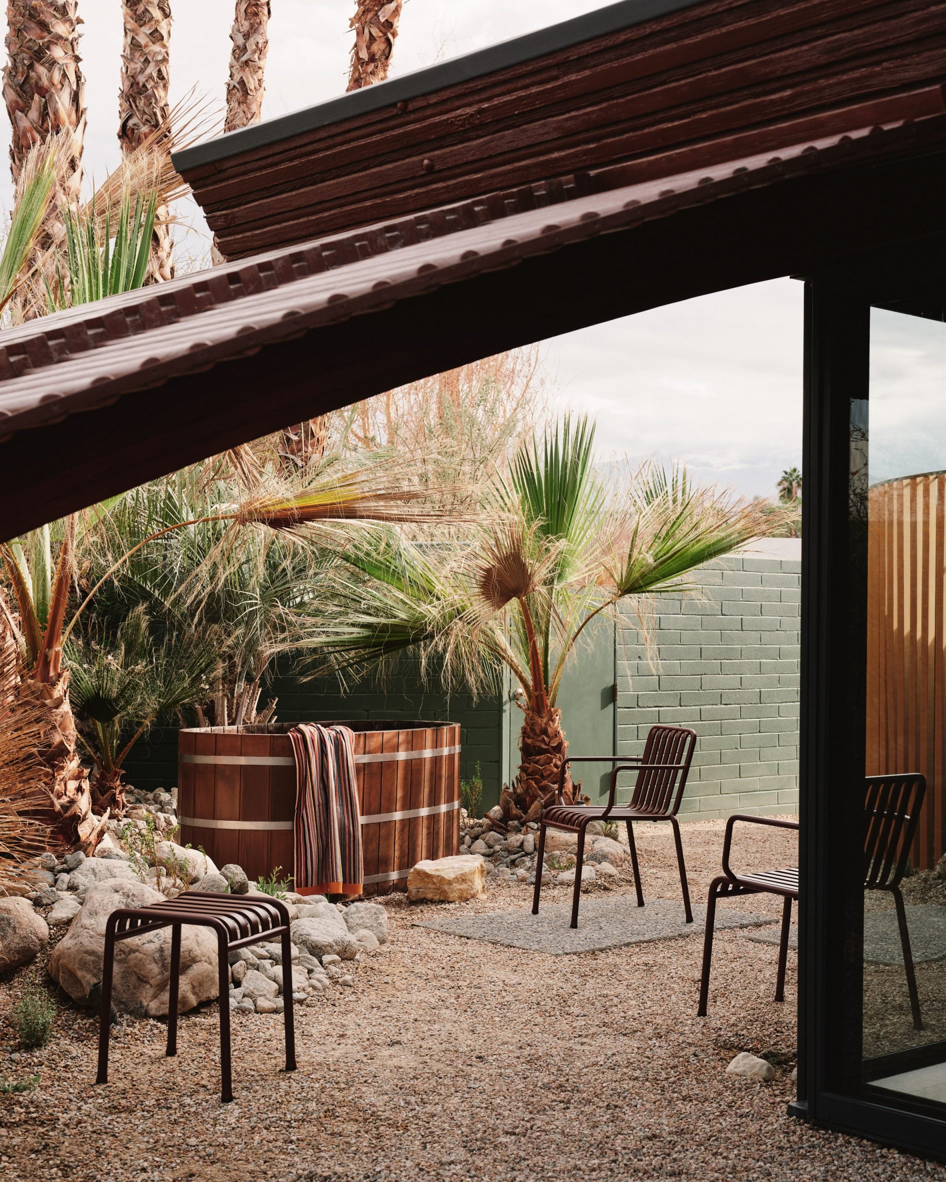 View Under a Curved Ceiling to a Barrel-Shaped Hot Tub and Outdoor Furniture