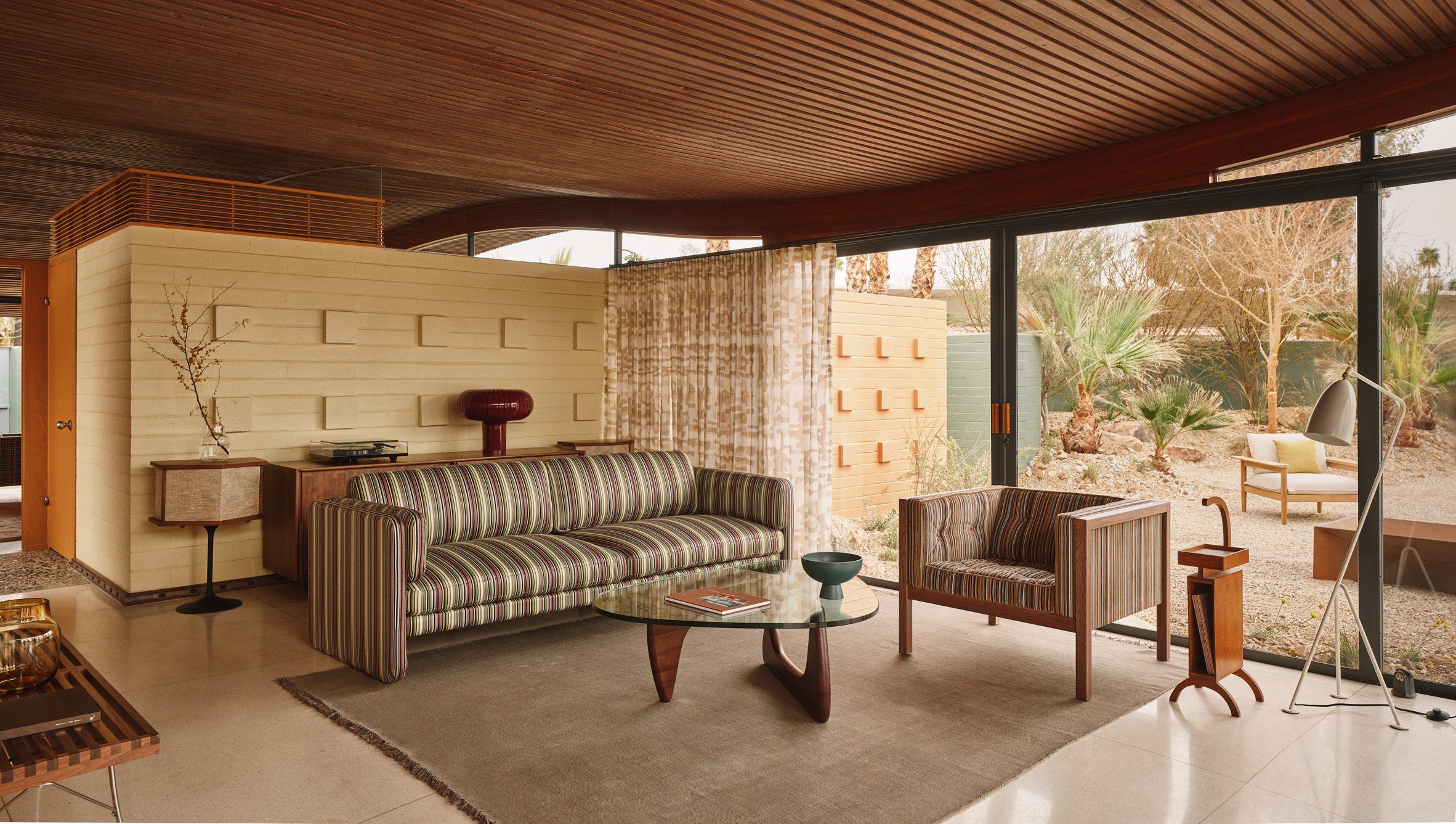 Living Room with a Cohesive Ceiling and Striped Furniture