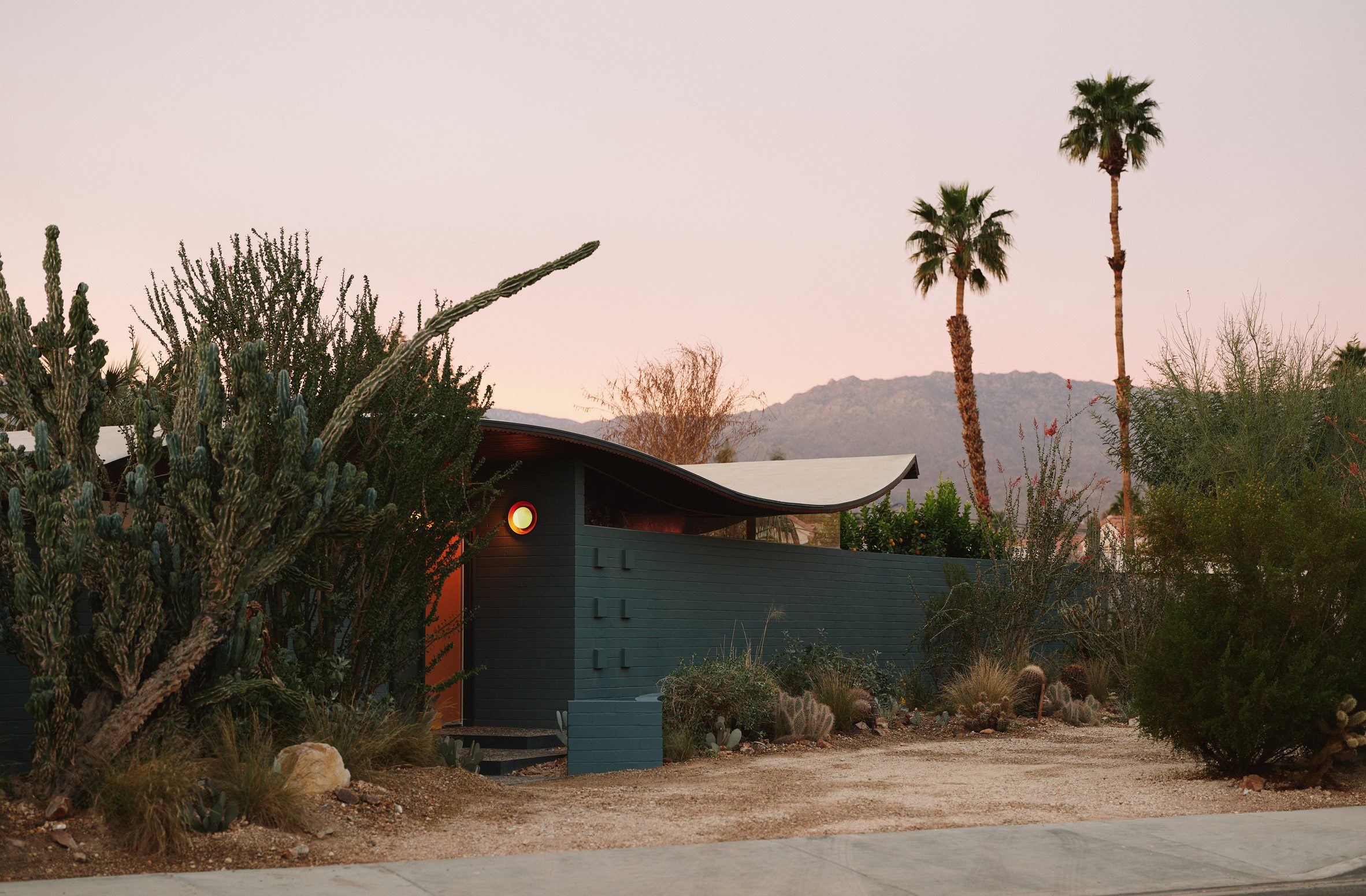 Miles C Bates House Express with Desert Plants and Palm Tree