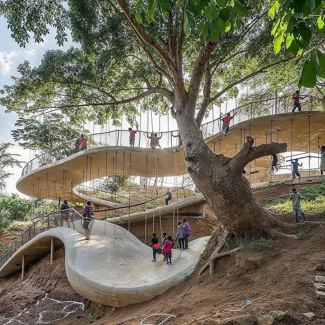Interior of a natural classroom in Kenya with vibrant colors and visible tree roots