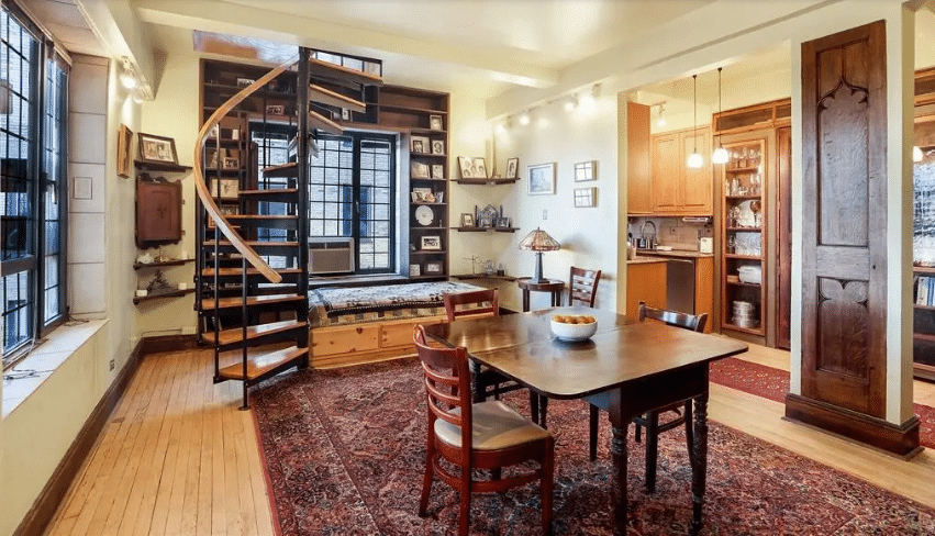 "A cozy living space with a spiral staircase and wooden furniture, showcasing the importance of second engineering opinions in construction projects."