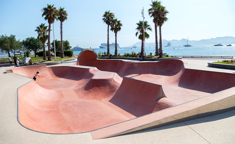 "Close-up of the skatepark bowl in Cannes, coated with red-tinted concrete."