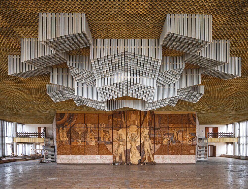 Interior of a building in Ukraine combining intricate architectural details and artistic decorations that reflect Soviet-era modernist influences.