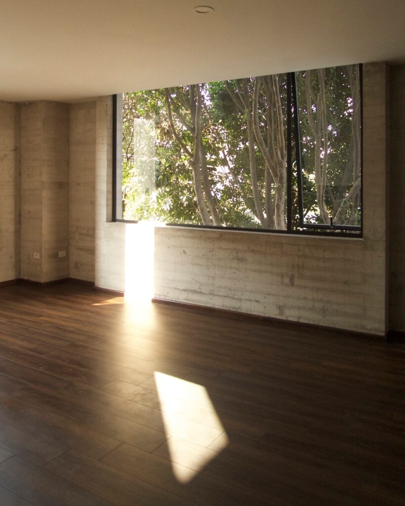 Interior room in Cuajimalpa residential project with large window and natural light