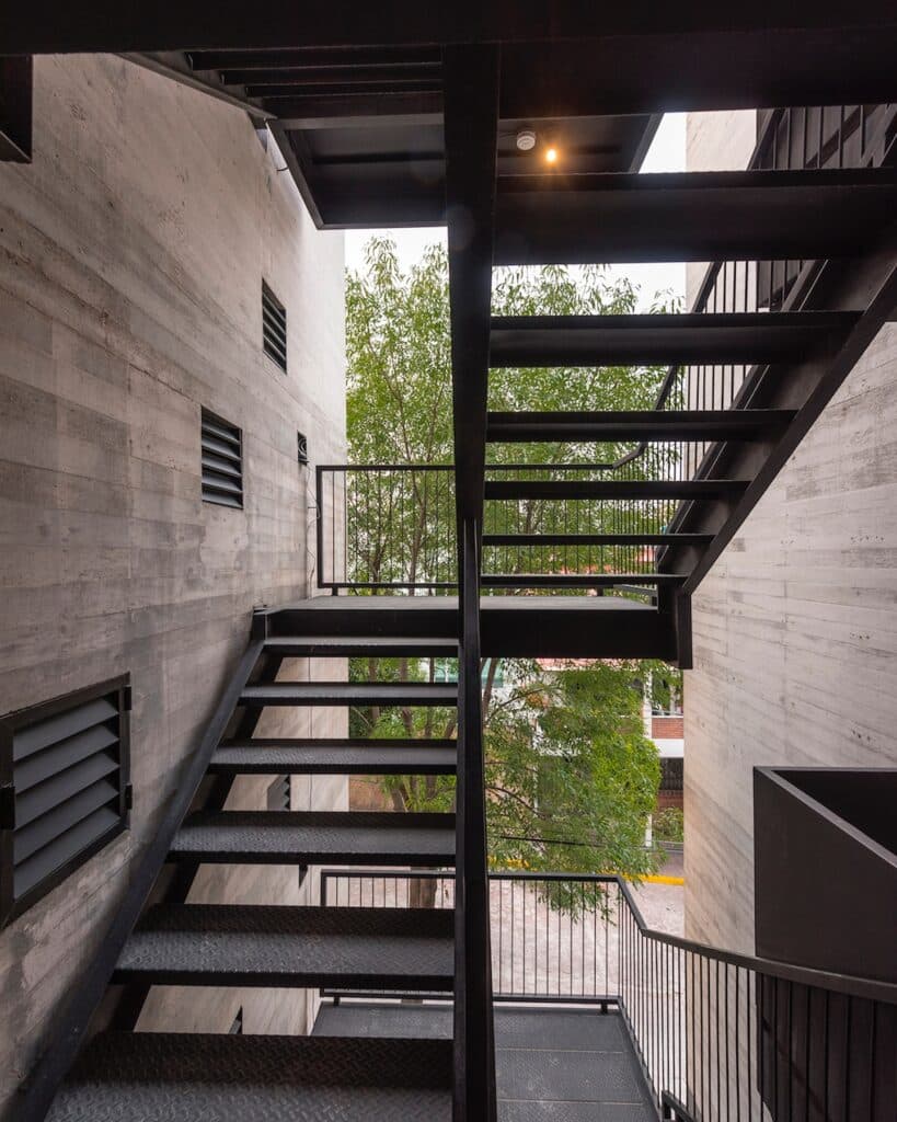 Exterior staircase in Cuajimalpa residential project with a view of surrounding trees