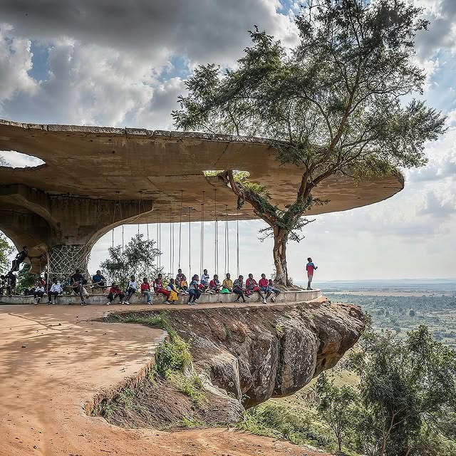 Children playing in a nature-integrated playground in Kenyan school