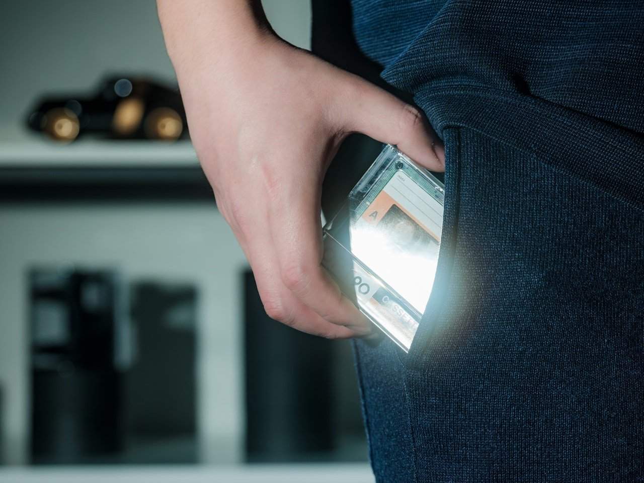 A person enjoying music on the Side A Cassette Speaker while working at a desk.