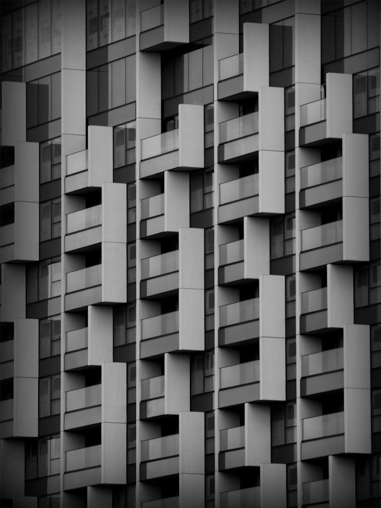 Close-up of a geometric facade with balconies in Rotterdam, highlighting modern architecture.
