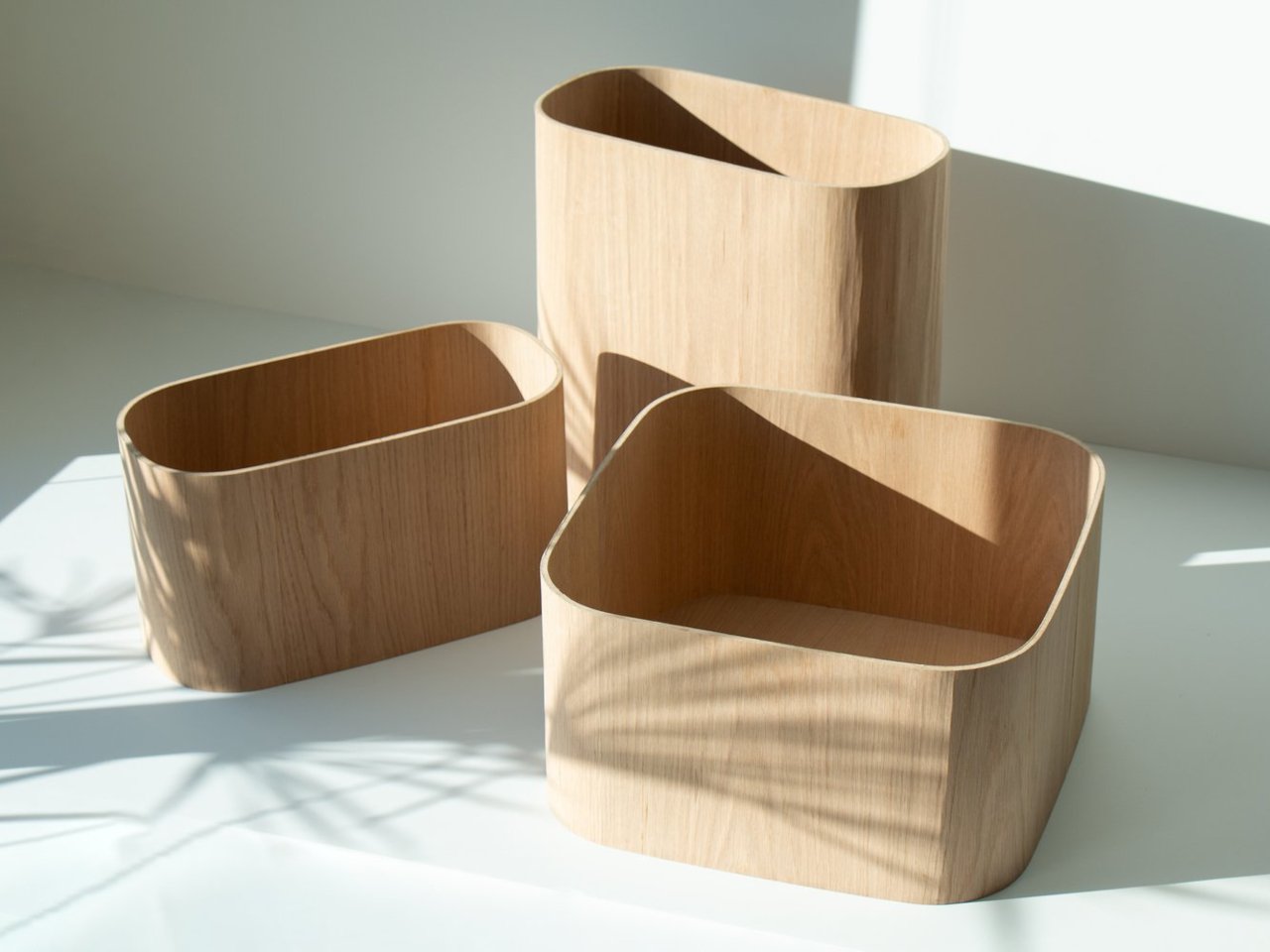 Wooden units with lids used for hidden storage or as trays
