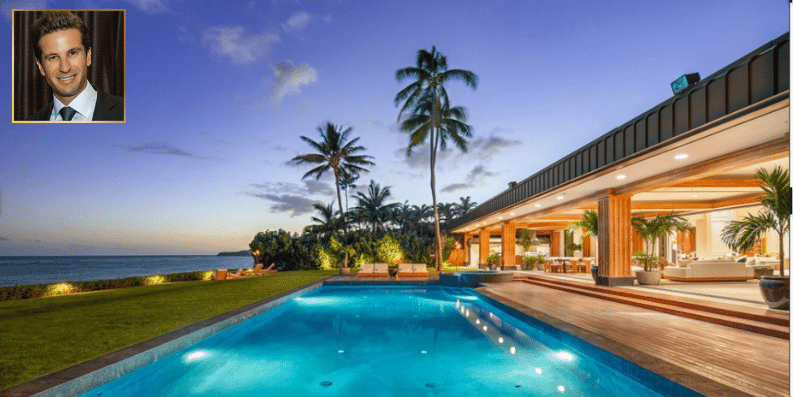 Oceanfront luxury home in Kahala with glass walls and tropical landscaping


