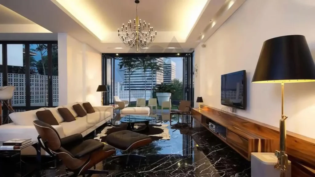 Modern living room highlighting uses of marble in polished black flooring
