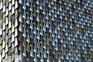 A 3D architectural model showcasing a complex and innovative design using BIM technology, featuring an intricate arrangement of interlocking geometric components in a visually striking pattern.
