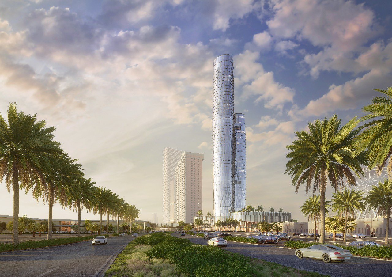 A group of business leaders and investors are seated at a conference table, signing an agreement to bring the prestigious St. Regis hotel brand to Jeddah. The backdrop features logos of key partners, including Marriott International and other stakeholders involved in the project.