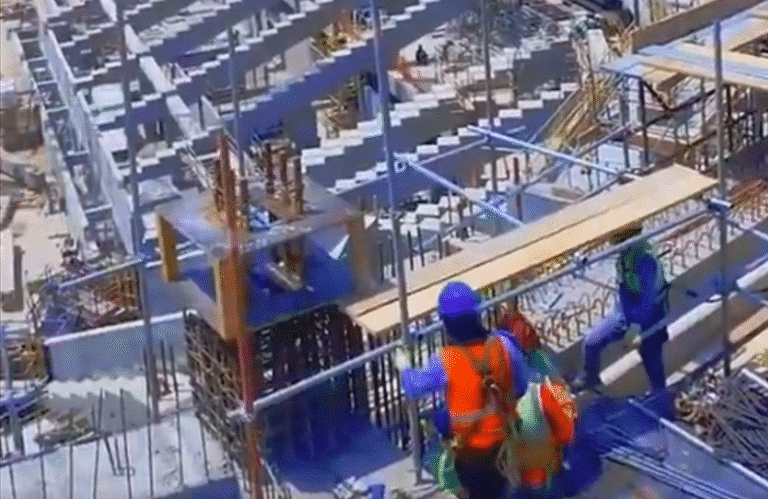 Construction workers are actively installing scaffolding and formwork systems on the upper tier of Aramco Stadium in Dammam. The site is bustling with activity, showcasing a well-coordinated effort to build the stadium's structure.