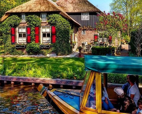 Traditional house with a boat on the canal reflecting Almere architectural design