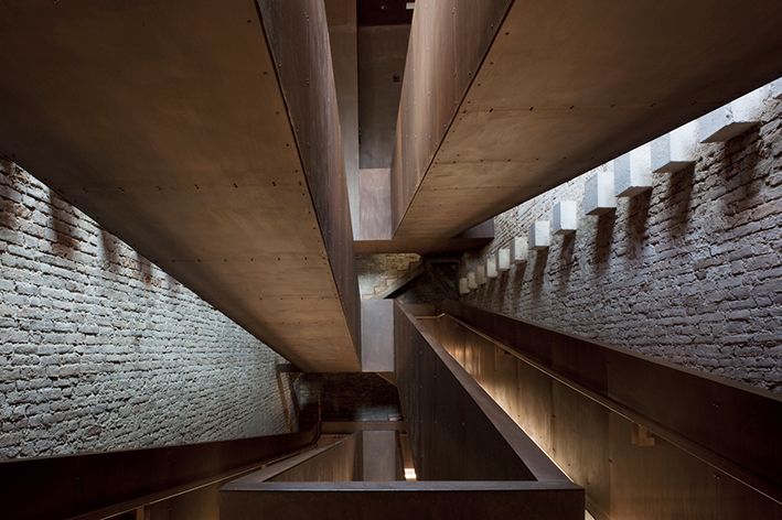 Modern interior design in Venice, using concrete and brick for the Venice Biennale events