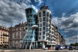 A striking building with a curving, dance-like design and a shiny glass facade, resembling a ballerina spinning on her toes.