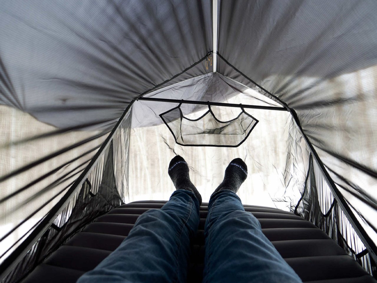 Traveler enjoying a comfortable sleep in the Haven Spectre hammock