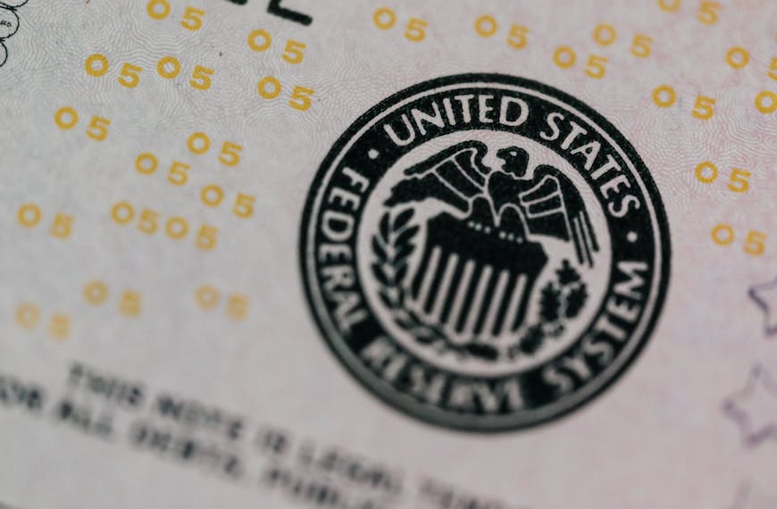 Detailed macro shot of the United States Federal Reserve System seal on paper currency.