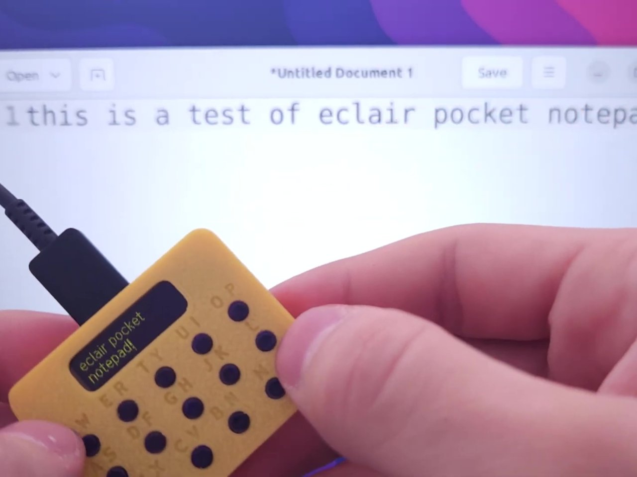 Eclair screen showing text in a simple yellow OLED display