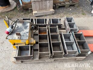 Metal molds of various sizes used to pour wet soil, an essential part of rammed earth wall construction.