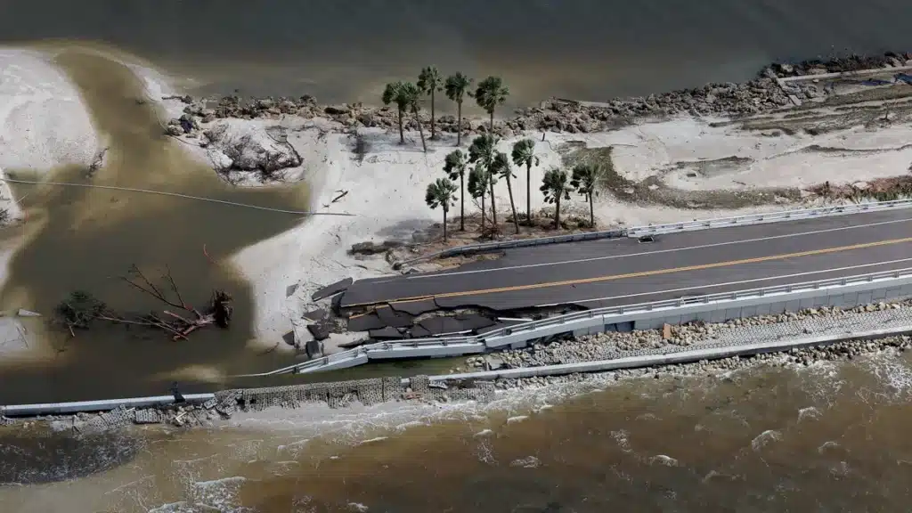 "Sanibel Causeway after Hurricane Ian’s destruction, with collapsed sections and severed link to the mainland."