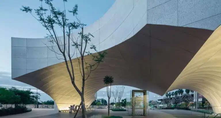 Modern architectural design reflecting Andalusian features with curved arches and white facades."