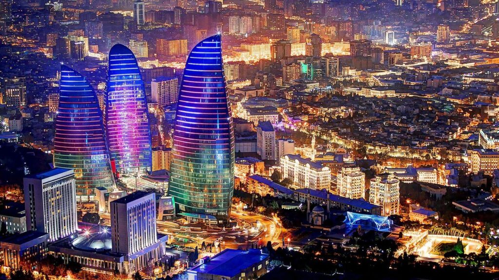 "Baku at night, illuminated with the Flame Towers showcasing its futuristic architecture."