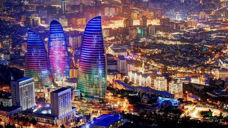 "Baku at night, illuminated with the Flame Towers showcasing its futuristic architecture."
